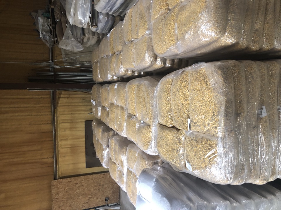 Pallets of clear-bagged feed shrink-wrapped and ready for the first stores.